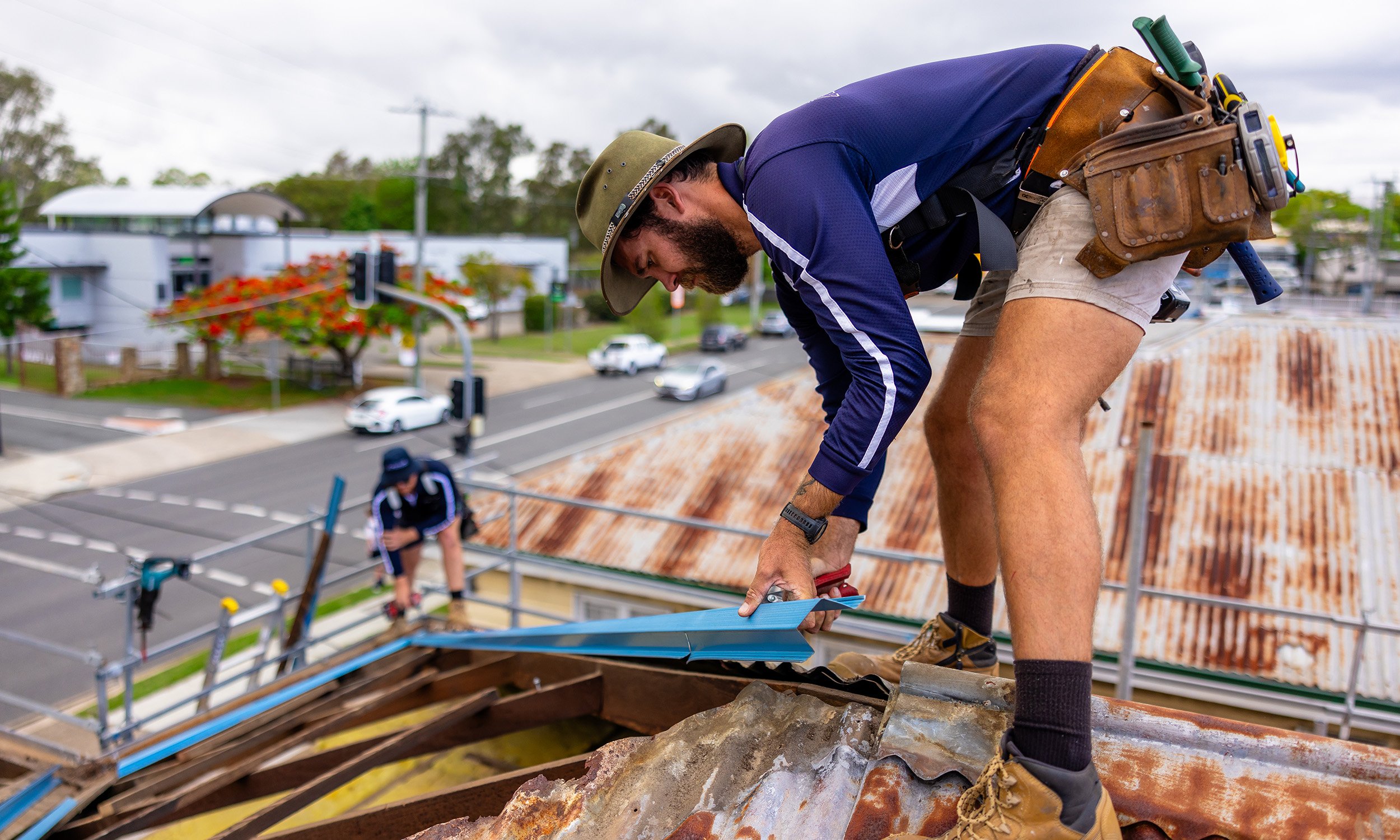 Ridgeline Roof Works team member working on a roof